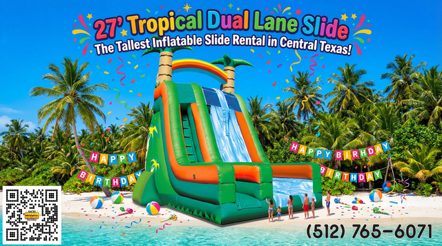 a giant double lane inflatable slide in a green tropical coloration setup on a tropical island with birthday decorations.