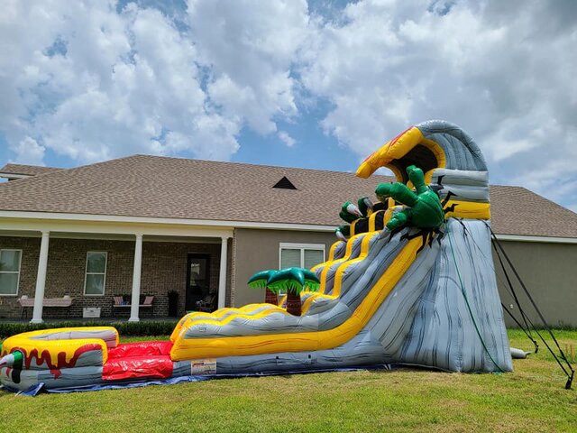 Side view of T-Rex waterslide from biloxi bounce house