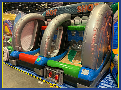 Angled view of the Hot Shot Inflatable with basketball wall design and clear subdivider.