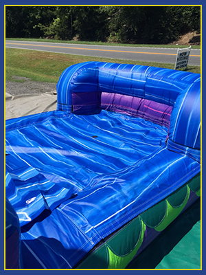 Angled view of the splash pad that is a part of the Atlantis Combo water slide.