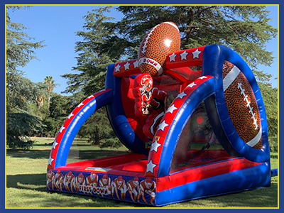 Side view of the All American football themed bouncy inflatable.