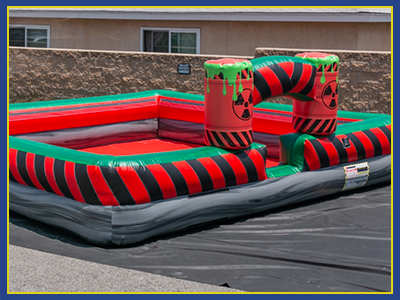 angled view of the red toxic themed foam pit with forest green trim.