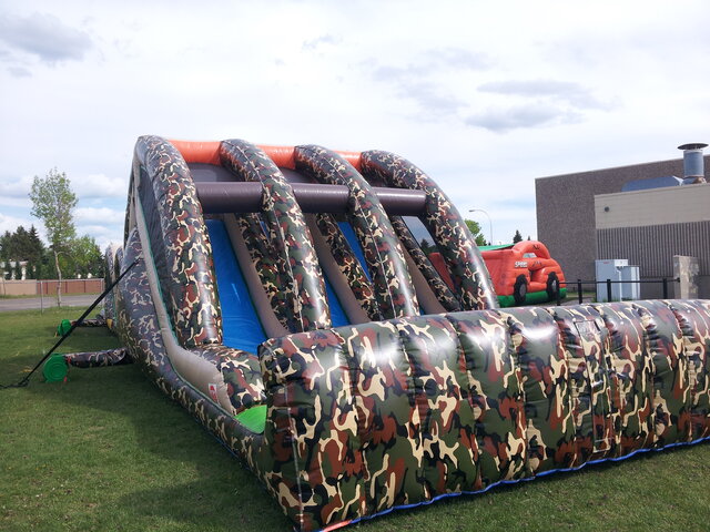 Triple lane inflatable slide