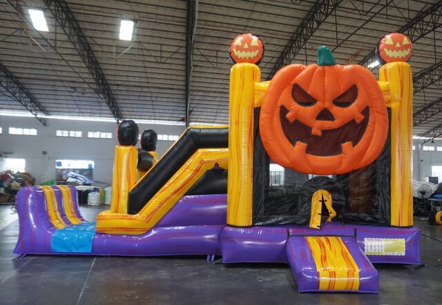Halloween Pumpkin Jump & Slide Combo inflatable rental featuring a giant jack-o'-lantern, bounce area and slide.