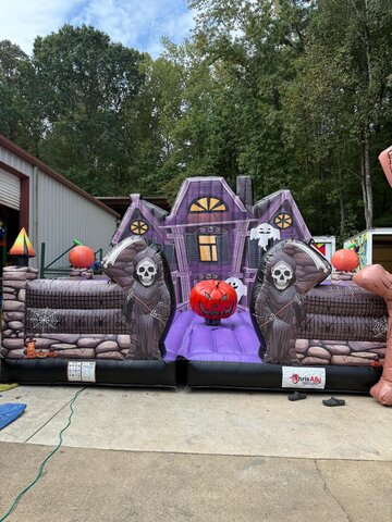 Haunted Mansion Mechanical Pumpkin rental with inflatable haunted house, grim reapers, ghosts and Halloween decorations in Dallas TX.