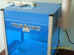 Commercial Sno Cone Machine with 25 cups and a shaping spoon. Commercial Sno Cone Machine with 25 cups and a shaping spoon.