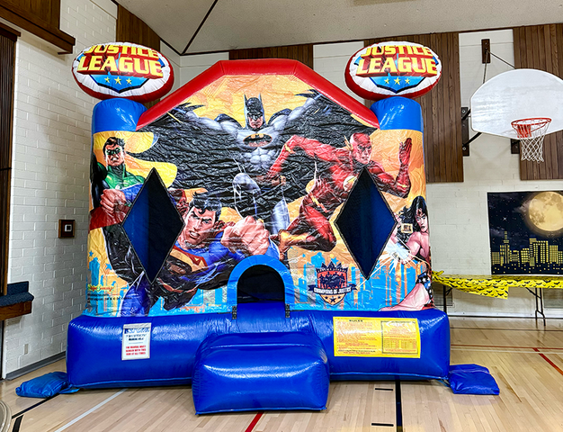 Justice League large bounce house rental in Utah featuring superhero themed inflatable for kids parties and events