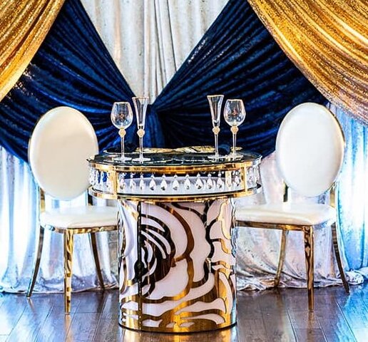 DRAMATIC ROUND GOLD/ WHITE AND CRYSTAL CAKE TABLE WITH GLASS TOP, IT CAN BE USED AS A SWEETHEART TABLES.