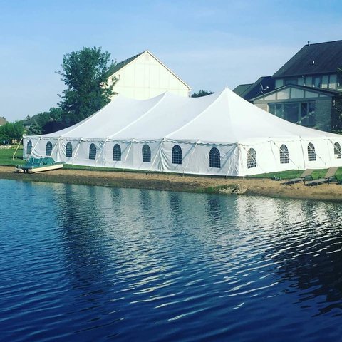 40' X 60' (2,400 square feet) Pole Tent on grass 40' X 60' (2,400 square feet) Pole Tent on grass
