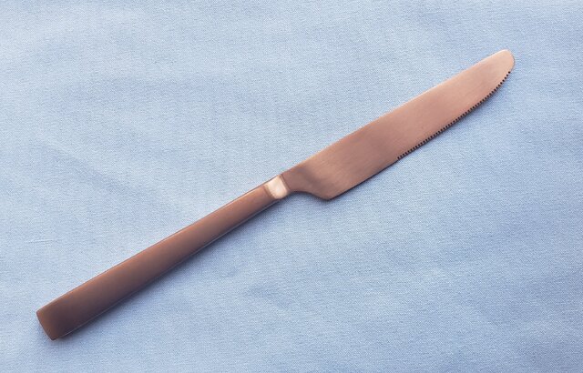 BRONZE SATIN DINER KNIFE.