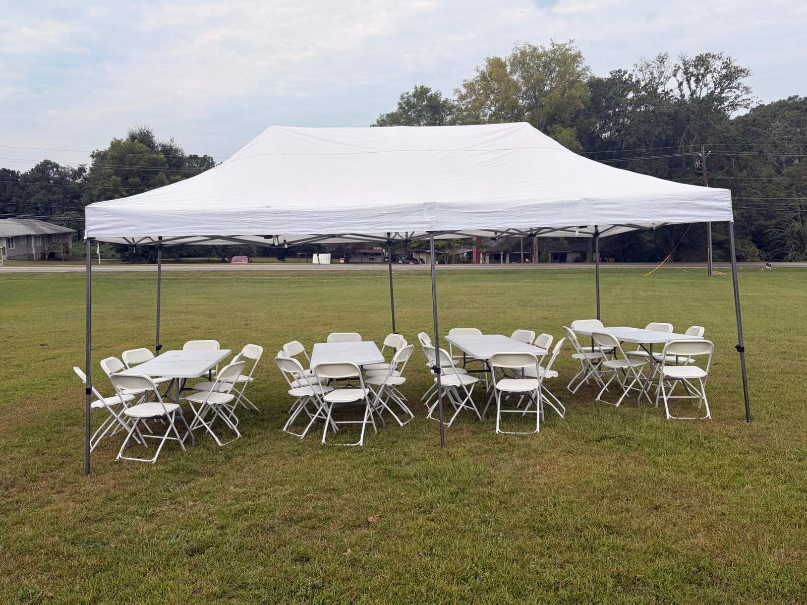 10x20 party tent with 6 ft rectangle tables in Loganville, GA