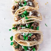 Catering: Taco Bar: Carnitas, Shredded Lime Chicken, Corn tortillas, flour tortillas, Mexican rice, Charro beans, salsa verde, salsa rojo, cilantro, onions, lettuce, cheese, Sour Cream, Pickled Jalapenos, Lime Wedges (Min 60)