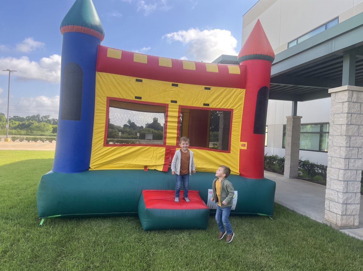 Classic bounce house set up on grass in Missouri City