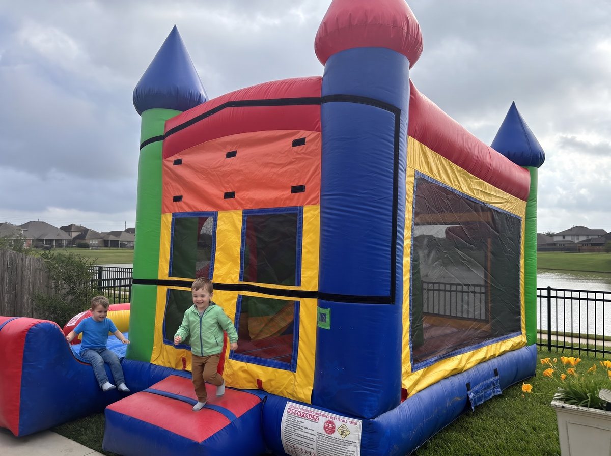 Kids playing at a Classic Combo 4 in 1 set up on grass in Katy