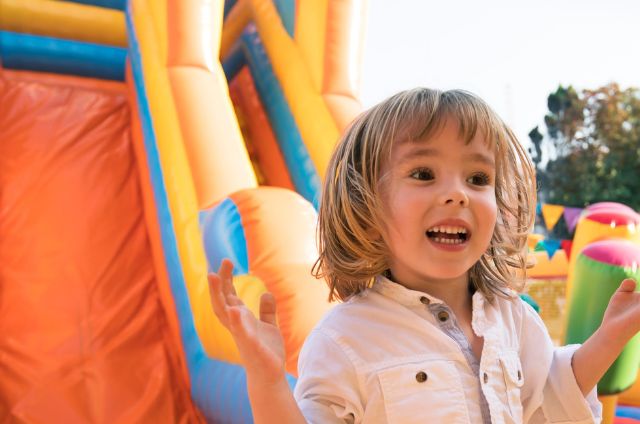 Combo bounce house with a slide set up for a birthday party in Hendersonville, NC