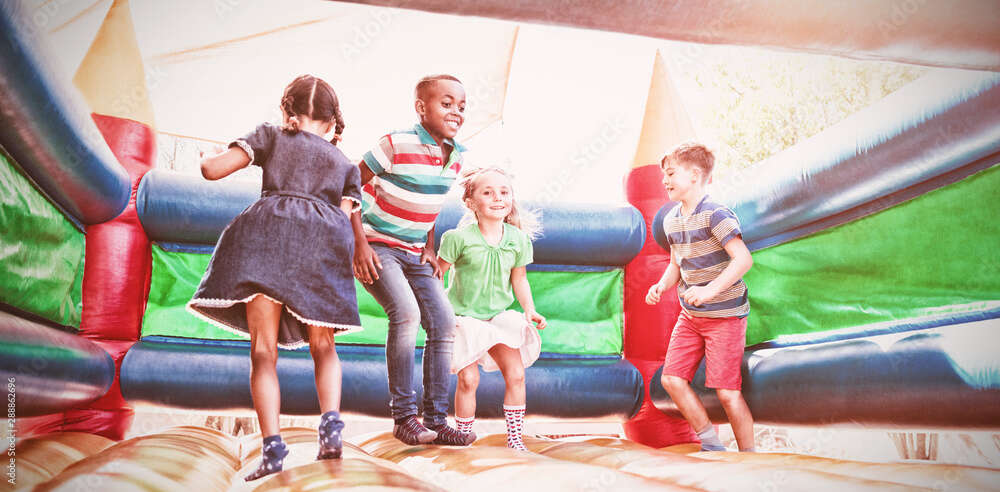 Children jumping in bounce house