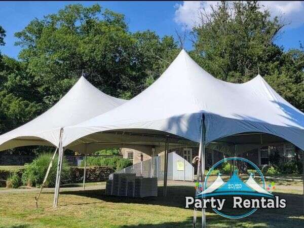 Sturdy frame tent in a bustling community festival setting