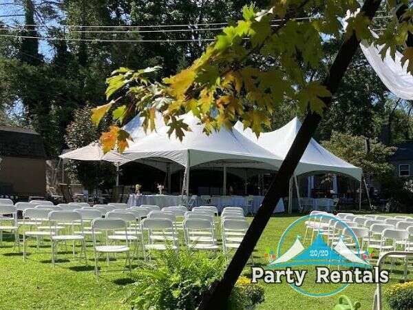 A grand wedding tent ready for a luxurious reception under the stars in Phoenixville, Pennsylvania.