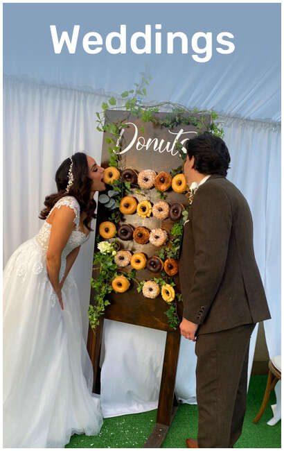 Newly-wed Couple Eats Wedding Donuts