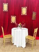 Red velvet backdrop with 4 gold frames 
