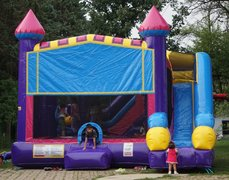 Looking for a bounce house rental near Wheaton, IL? We have just the thing! Our inflatable bounce house comes with a slide and basketball hoop for hours of fun.