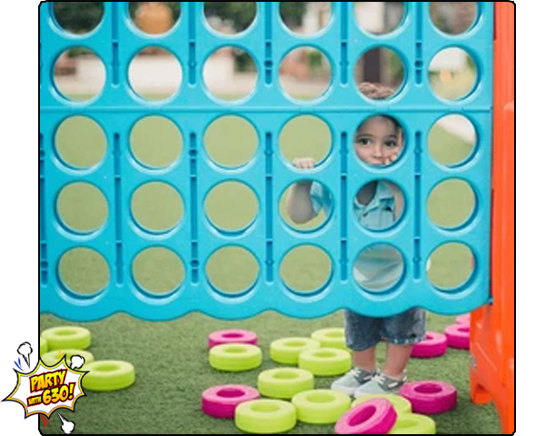 Toddler playing Giant Connet 4