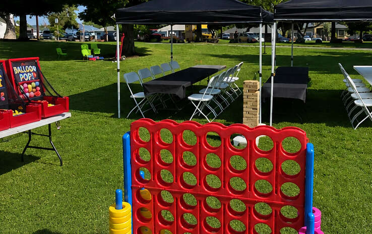 Party With 630 stress-free party setup with tables, chairs, canopy tents, and outdoor games ready for guests