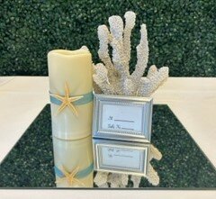 Coral, Candle, and Sign Centerpiece