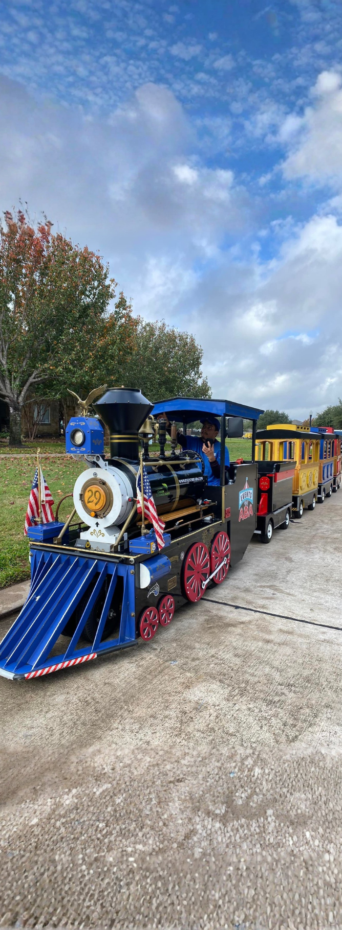 Events by ABA trackless mini train rental with American flags.