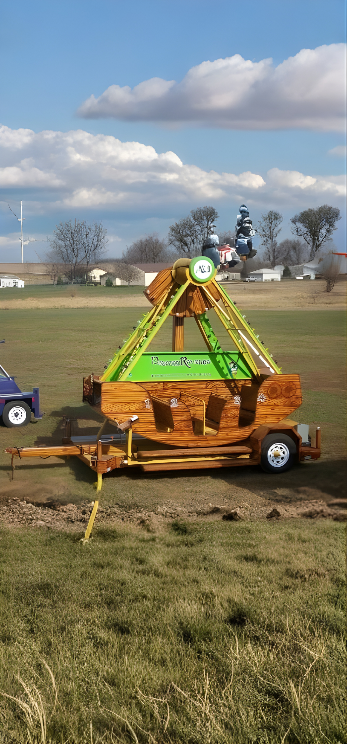 Events by ABA Pirates Revenge swing ride set up on grass.