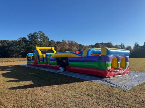 A&B Party Rentals inflatable obstacle course setup outdoors