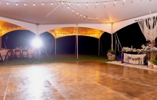 A&B Party Rentals outdoor dance floor setup under tent