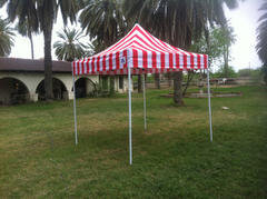 An awning rental provides shade to keep your party guests comfortable. Colors and styles may vary