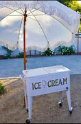 ICE CREAM CART ( WITH WHEELS & UMBRELLA  1$ A POUND)