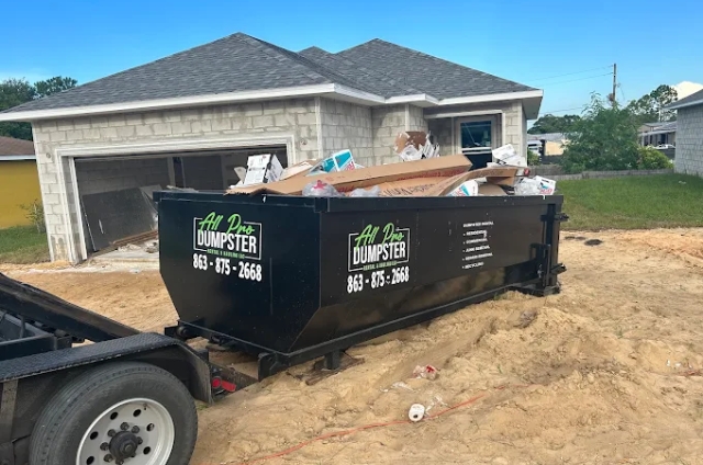 Construction site cleanup and land clearing dumpster from All Pro Dumpster Rental & Hauling, LLC