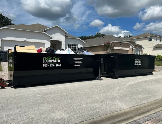 Black roll-off dumpsters from All Pro Dumpster Rental & Hauling, LLC positioned for large-scale waste removal project Black roll-off dumpsters from All Pro Dumpster Rental & Hauling, LLC positioned for large-scale waste removal project