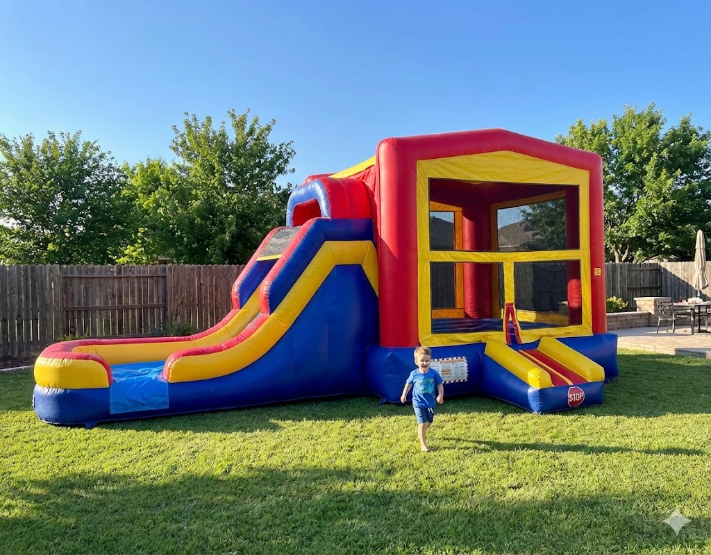Large red, blue, and yellow inflatable bounce house combo with a slide set up in a sunny Cedar Hill, TX backyard for a kids' party.