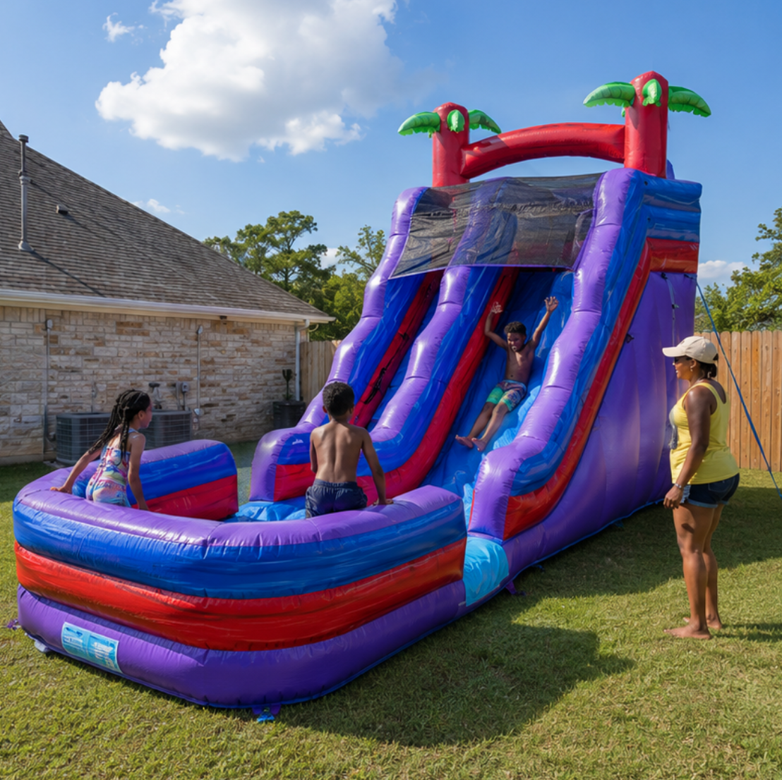 Kids playing on a water slide and bounce house rental during an outdoor party in DeSoto, Texas, from A Party Solution.