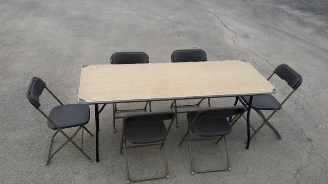 6 foot adult table with 6 brown adult chairs (renter to setup)
