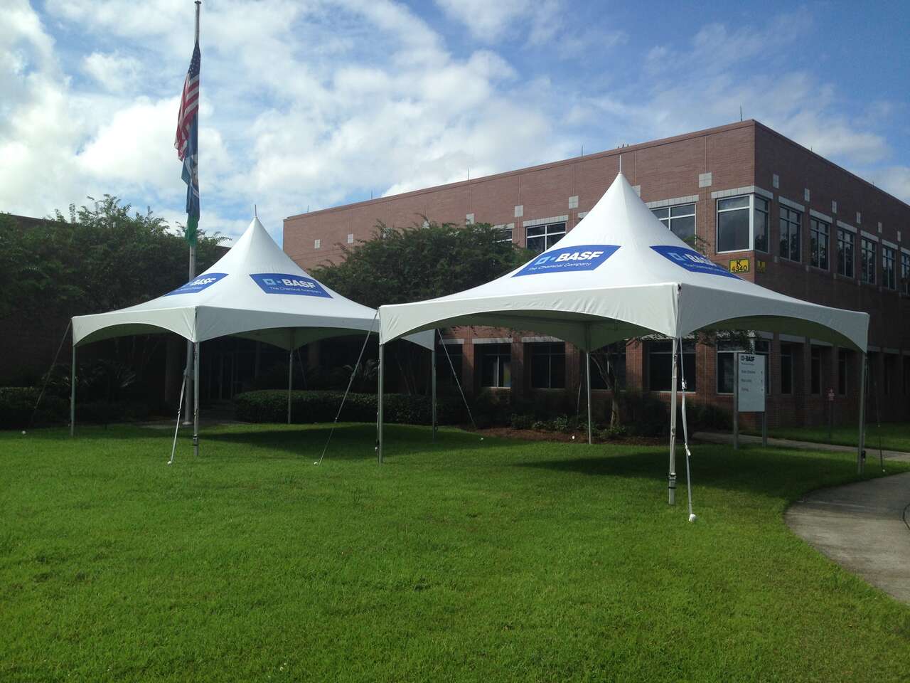 Custom BASF branded tents set up at a plant office by Ascension Party Rentals
