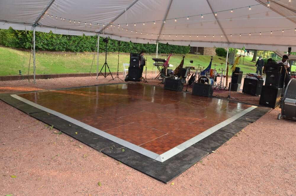 Wooden dance floor setup for a wedding reception by Atlantic Tent Company