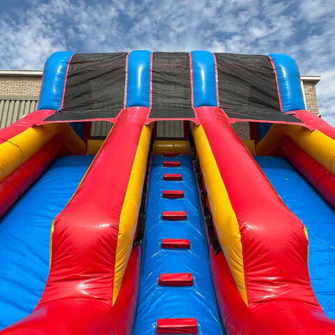Double Crush Water Slide looking up the central stairway into the sky at Austin Bounce House Rentals