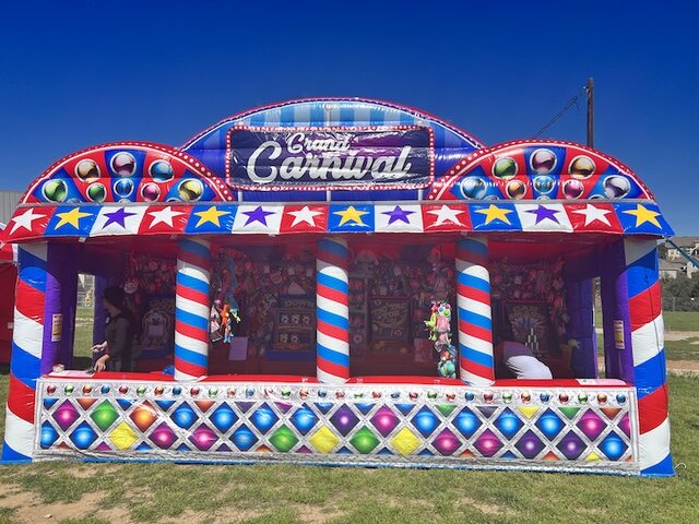 Grand Carnival Midway Experience game booth long shot front.