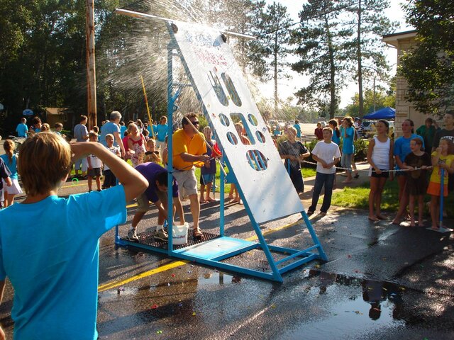 Water wars game action splash shot from Austin Bounce House Rentals