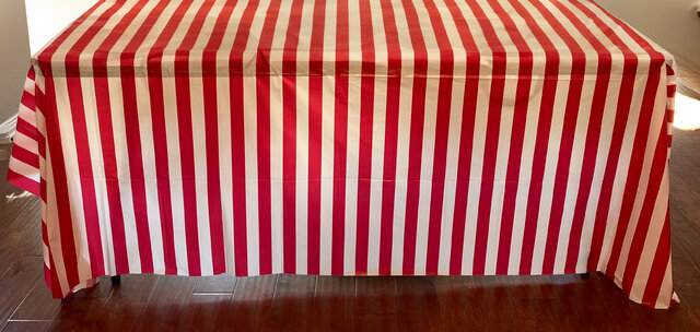 Red and White Plastic Table Covers sold in Austin Texas from Austin Bounce House Rentals
