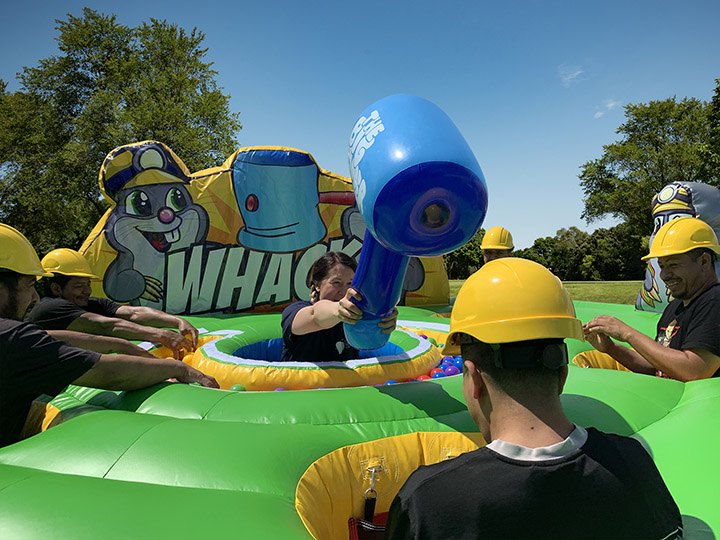 Players playing wacky mole game in Austin TX