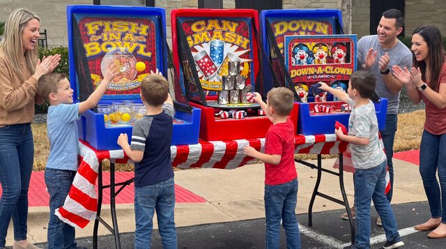 Kids playing on the 3-Game Home Carnival rental from Austin Bounce House Rentals