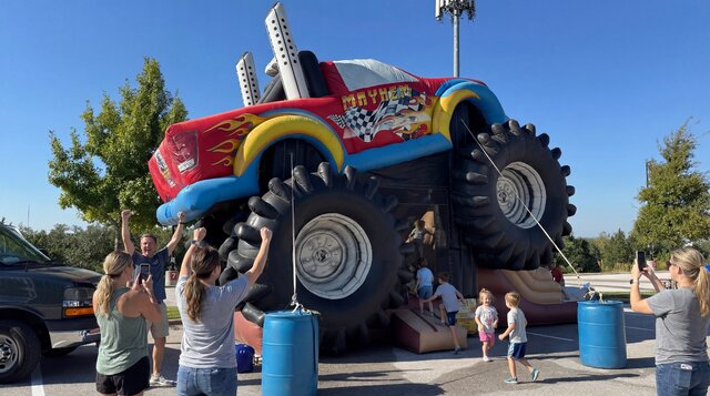 Monster truck combo with kids and parents playing on a nice Austin Texas day.