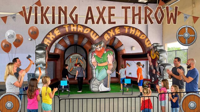 Viking Axe Throw inflatable game rental from Austin Bounce House Rentals™ with kids playing and parents watching 
