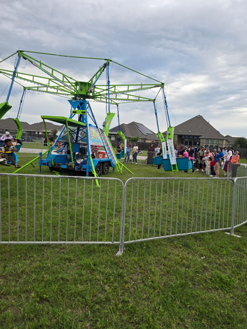 Kids swing carnival ride rental at a Greater Austin community event - Jump Around Party Rentals